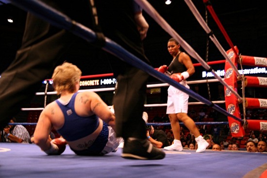 Figueroa (left) finds herself in the unfamiliar position of being down on the canvas