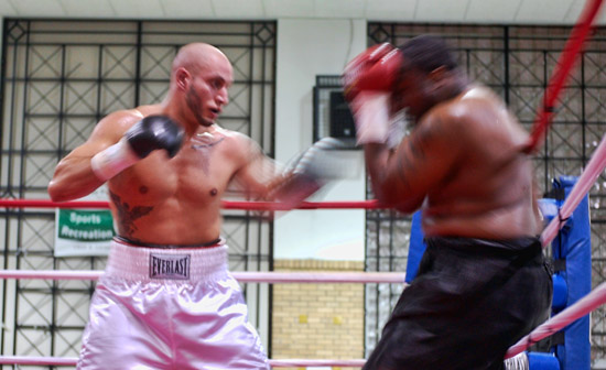 Latoria drives Glover to the ropes