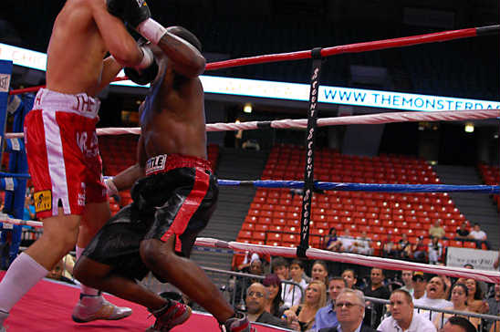 A right from Herrera (L) buckles Smith's knees at the end of the bout