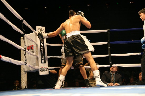 Jiminez rips with a wide left hook.