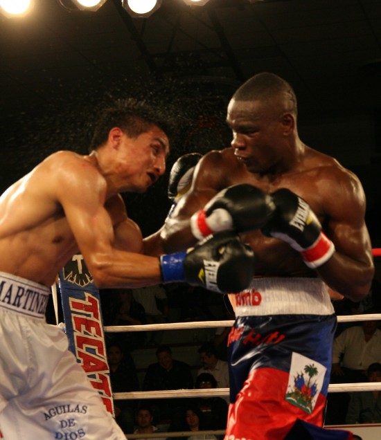 Cherry (right) bounces a hard right off the chin of Martinez.