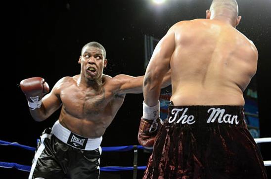 Elijah McCall (L) charges in behind a jab