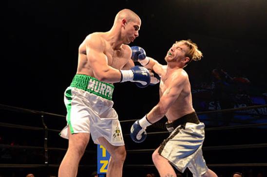 Andrew Kato (R) throws a wild overhand right at Jimmy Murphy