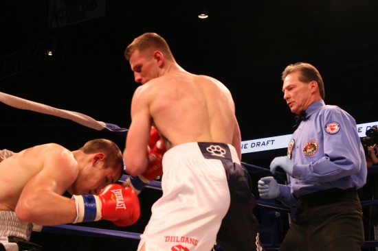 Fonfara (center) nearly takes Karpency out in the first round, as referee Pete Podgorski looks on.
