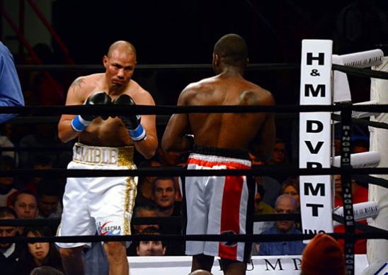 Jose Luis Castillo (L) tries to find an opening against Antwone Smith