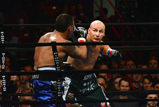 Szpilka (R) works to keep Mollo's wounds open