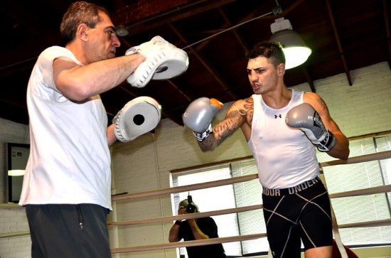 Donovan George, right, works the focus mitts with his father, Pete.