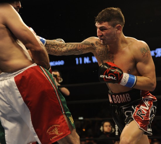 Donovan George (at right) rips a right hand to David Lopez's body (photo courtesy of Tom Barnes)