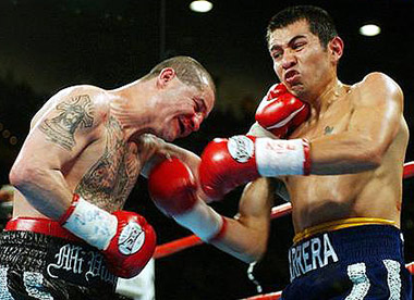 Barrera's uppercuts bloody Tapia's nose